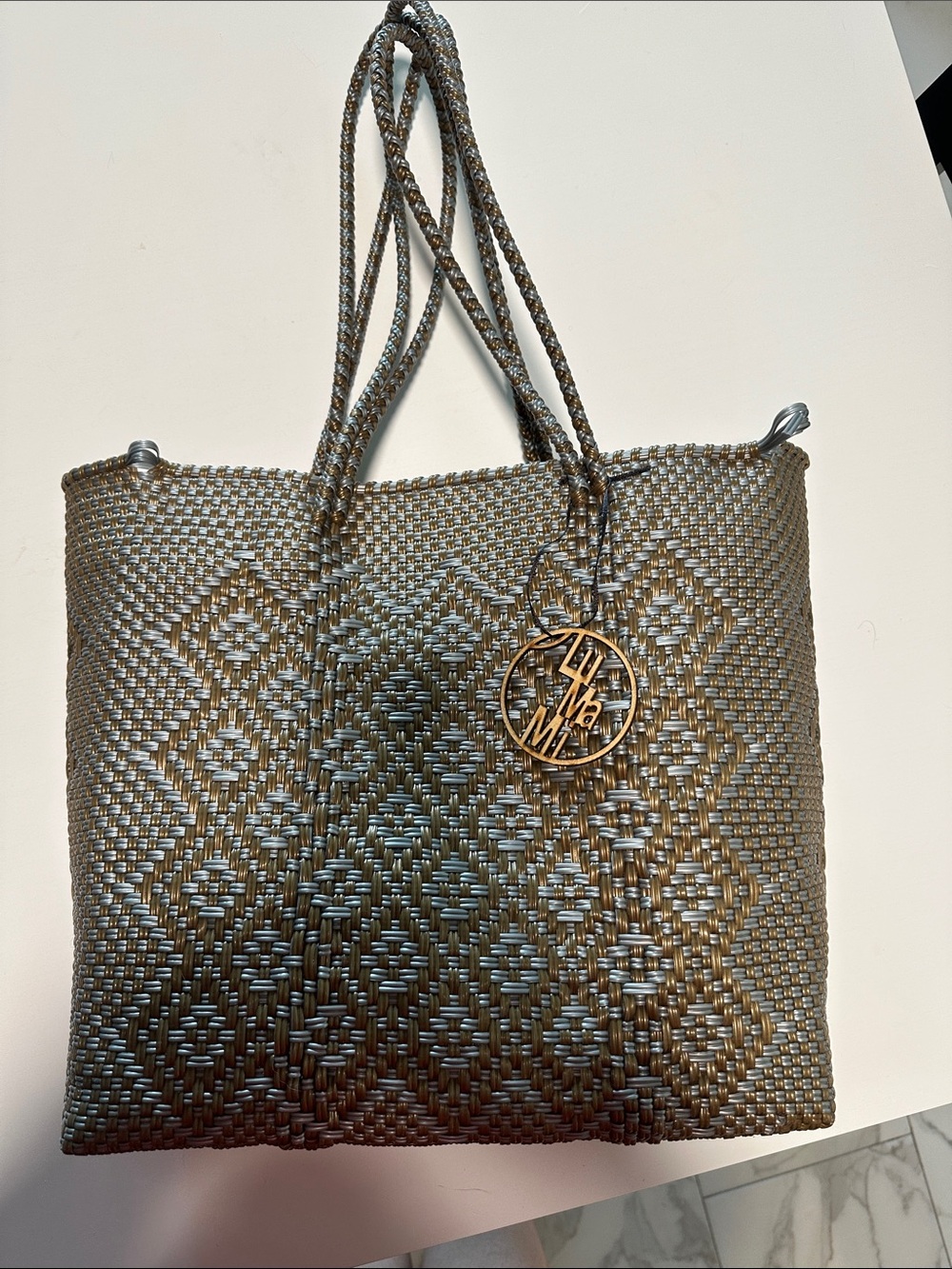 Woven Metallic Gray Tote with Gold Charm